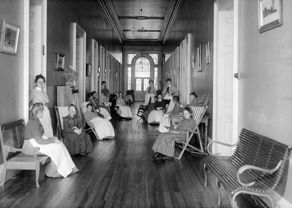 Female Patients Sit with Staff at the St. Louis City Insane Asylum, 1904. Made public under the CCO 1.0 Universal Public Domain Dedication